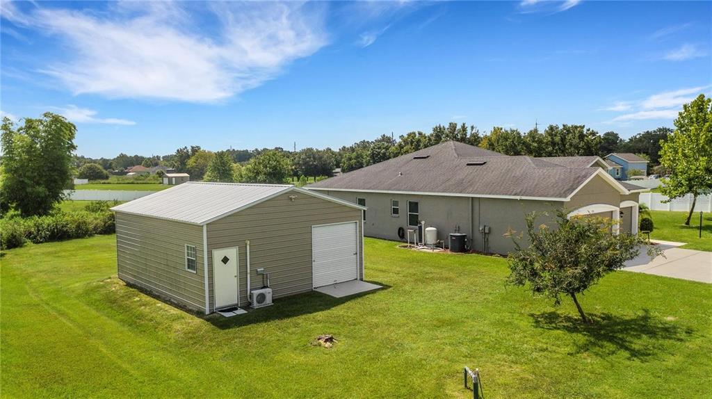 1918 Berry Road Plant City, FL 33567 - Photo 40 of 53 a aerial view of a house in a big yard with large trees