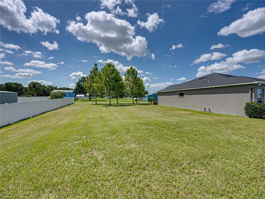 1918 Berry Road Plant City, FL 33567 - Photo 53 of 53 a yellow house with garden in front of it