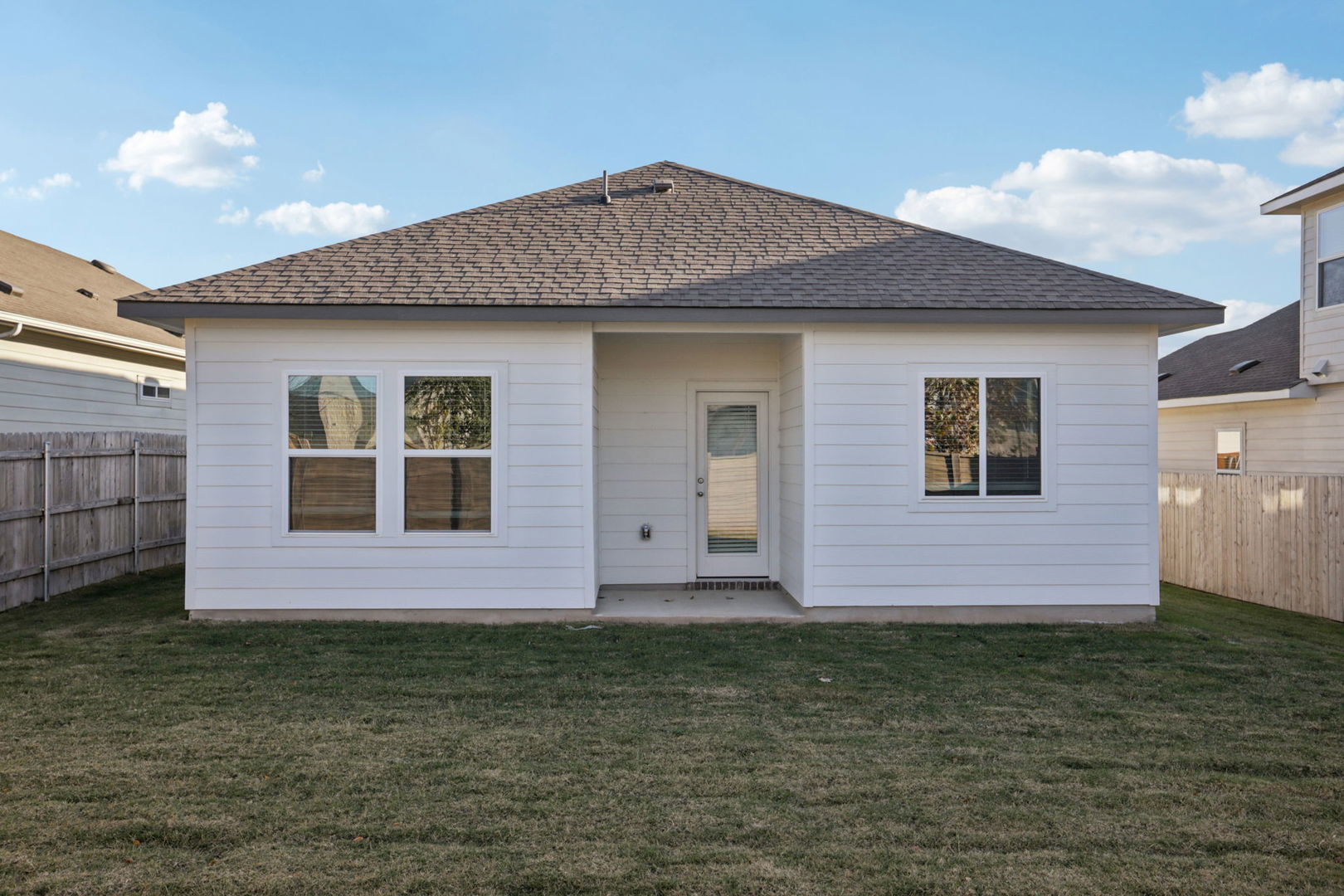 120 Outlaw Drive Jarrell, TX 76537 - Photo 11 of 16 Back of house featuring a patio area, a fenced backyard, and roof with shingles