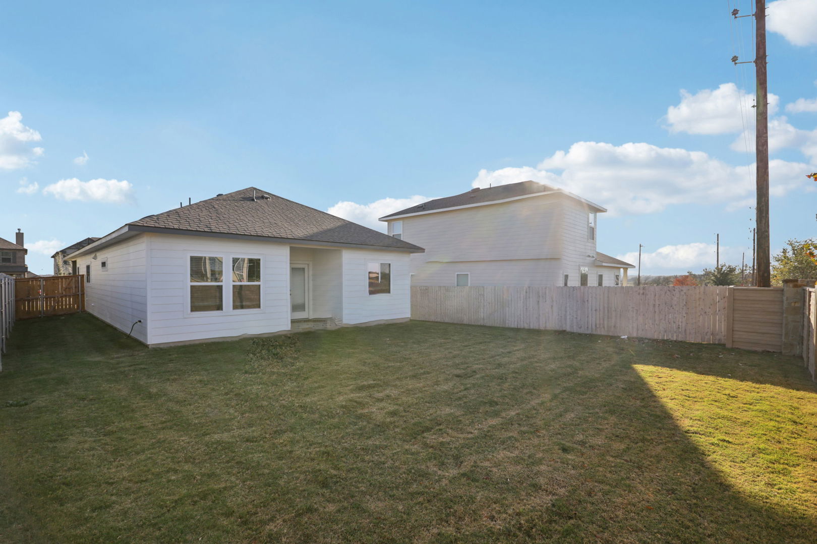 120 Outlaw Drive Jarrell, TX 76537 - Photo 12 of 16 Rear view of property with a fenced backyard