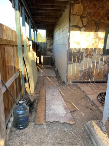 a view of a porch with wooden floor