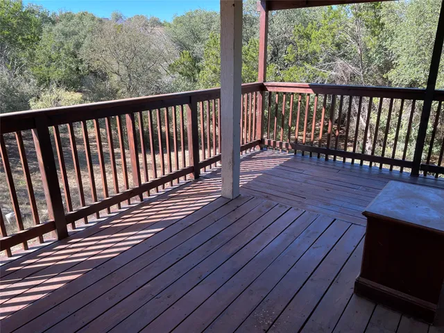 a view of balcony with wooden floor