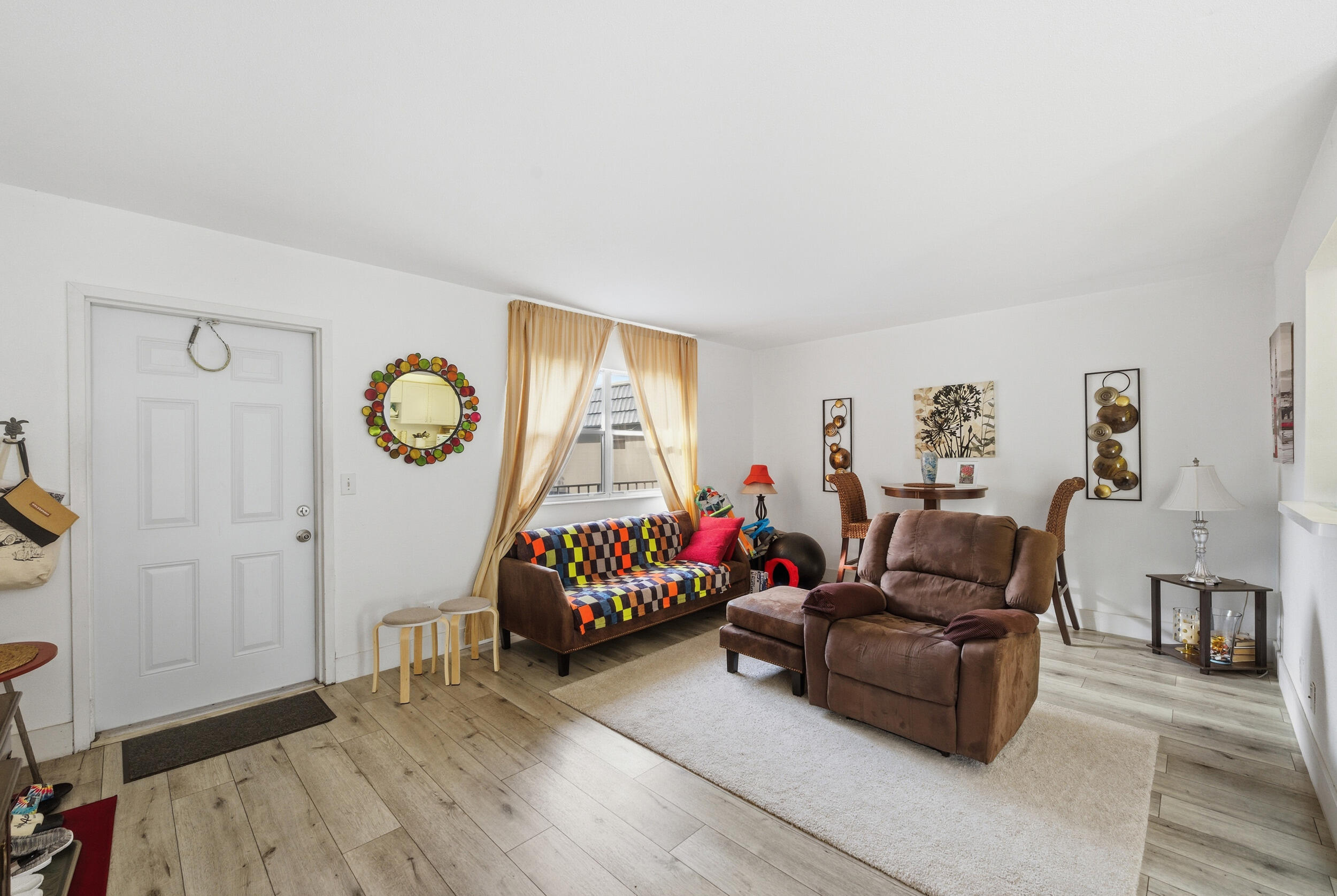 374 Tuscany Lane, Unit G Delray Beach, FL 33446 - Photo 11 of 21 a living room with furniture and a wooden floor