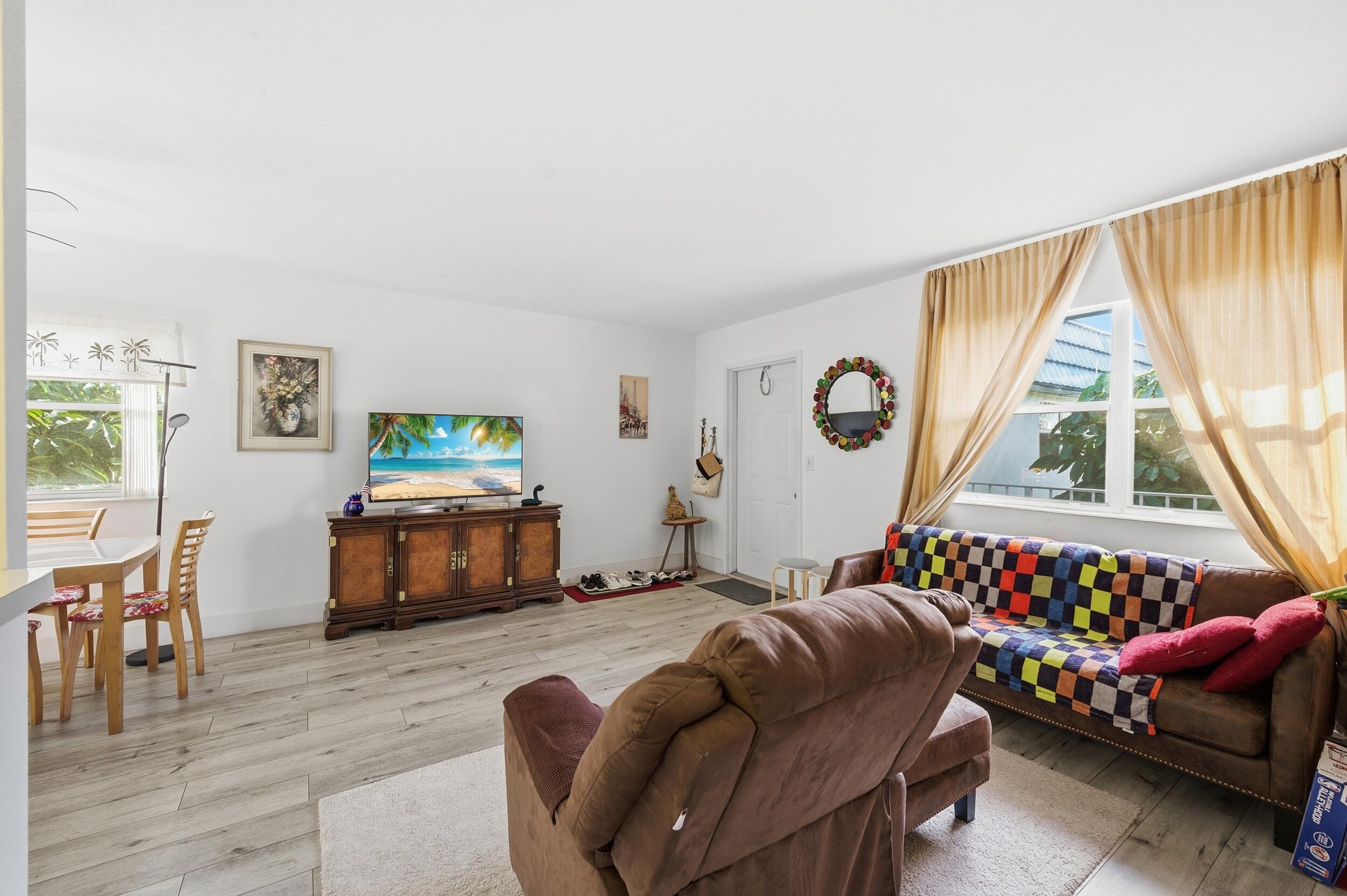 374 Tuscany Lane, Unit G Delray Beach, FL 33446 - Photo 12 of 21 a bedroom with bed and a window