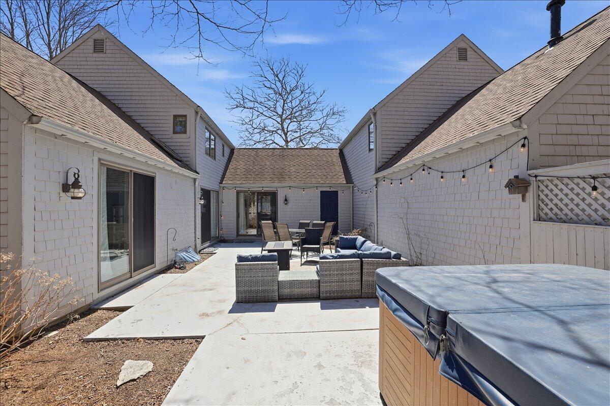 100 Mid-Iron Way, Unit 7027 Mashpee, MA 02649 - Photo 24 of 38 a outdoor space with furniture