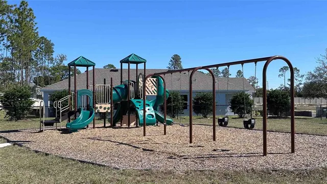 a view of a swimming pool with an outdoor seating