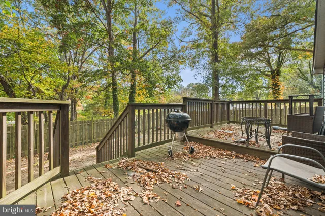 a view of a wooden deck with a bench