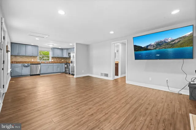 a view of kitchen and wooden floor