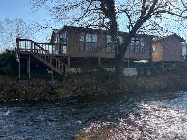 129 Mallard Loop Waynesville, NC 28785 - Photo 12 of 40 a view of a house with yard and a tree