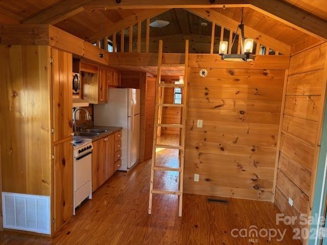 129 Mallard Loop Waynesville, NC 28785 - Photo 17 of 40 a kitchen with stainless steel appliances a refrigerator and a stove