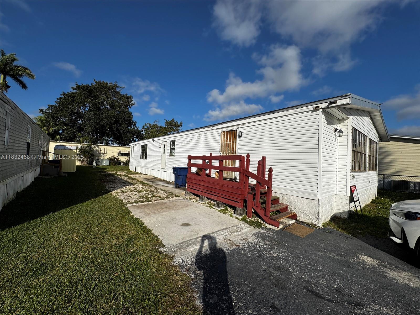 35250 Southwest 177th Court, Unit 136 Homestead, FL 33034 - Photo 9 of 18 a view of a house with a yard