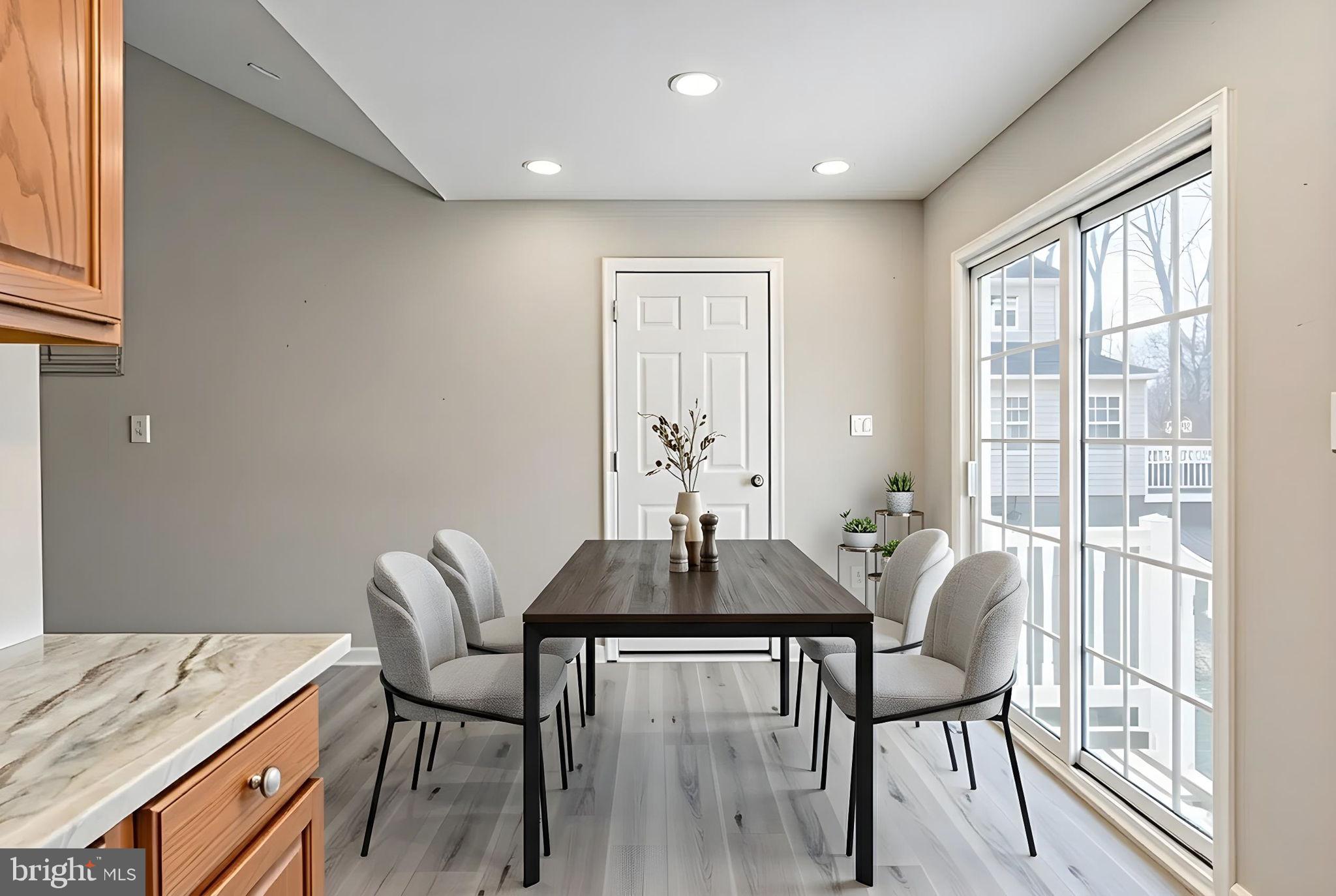 219 Santa Maria Avenue Colonial Beach, VA 22443 - Photo 12 of 52 a dining room with a table and chairs