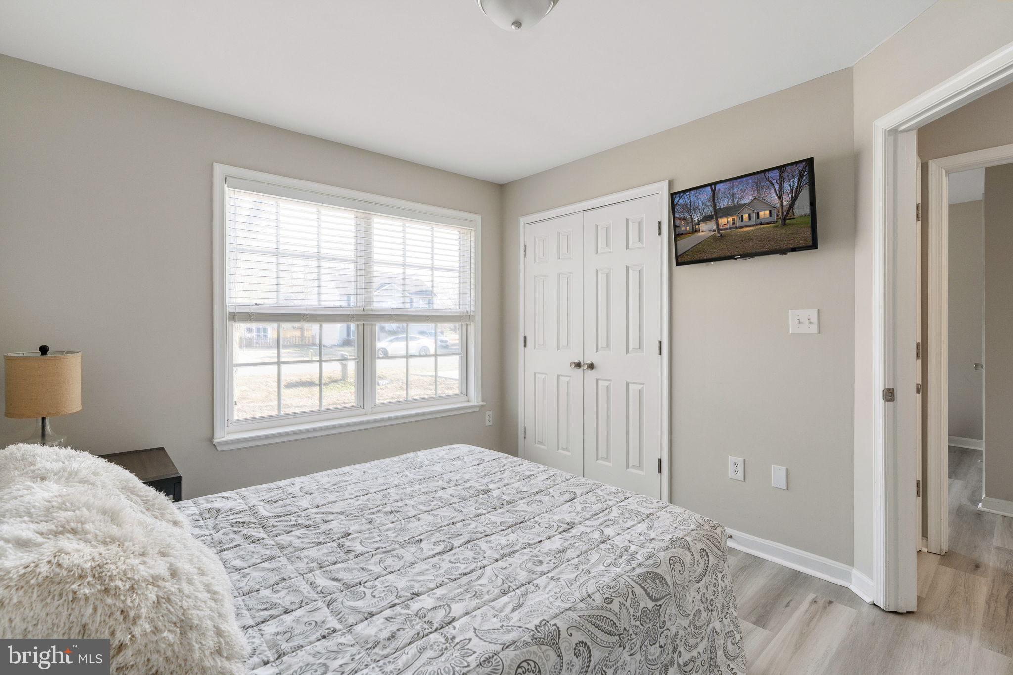 219 Santa Maria Avenue Colonial Beach, VA 22443 - Photo 24 of 52 a bedroom with a bed and a window