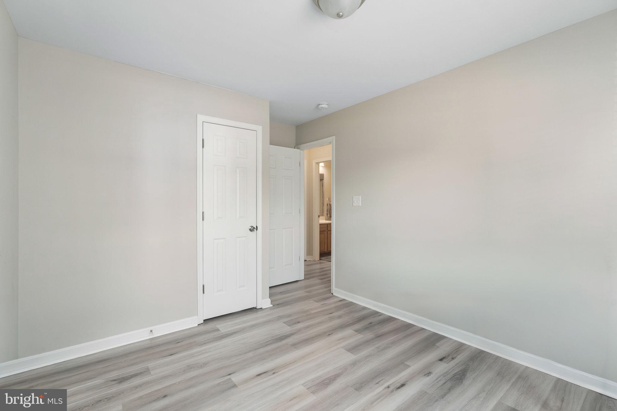 219 Santa Maria Avenue Colonial Beach, VA 22443 - Photo 27 of 52 a view of an empty room with wooden floor