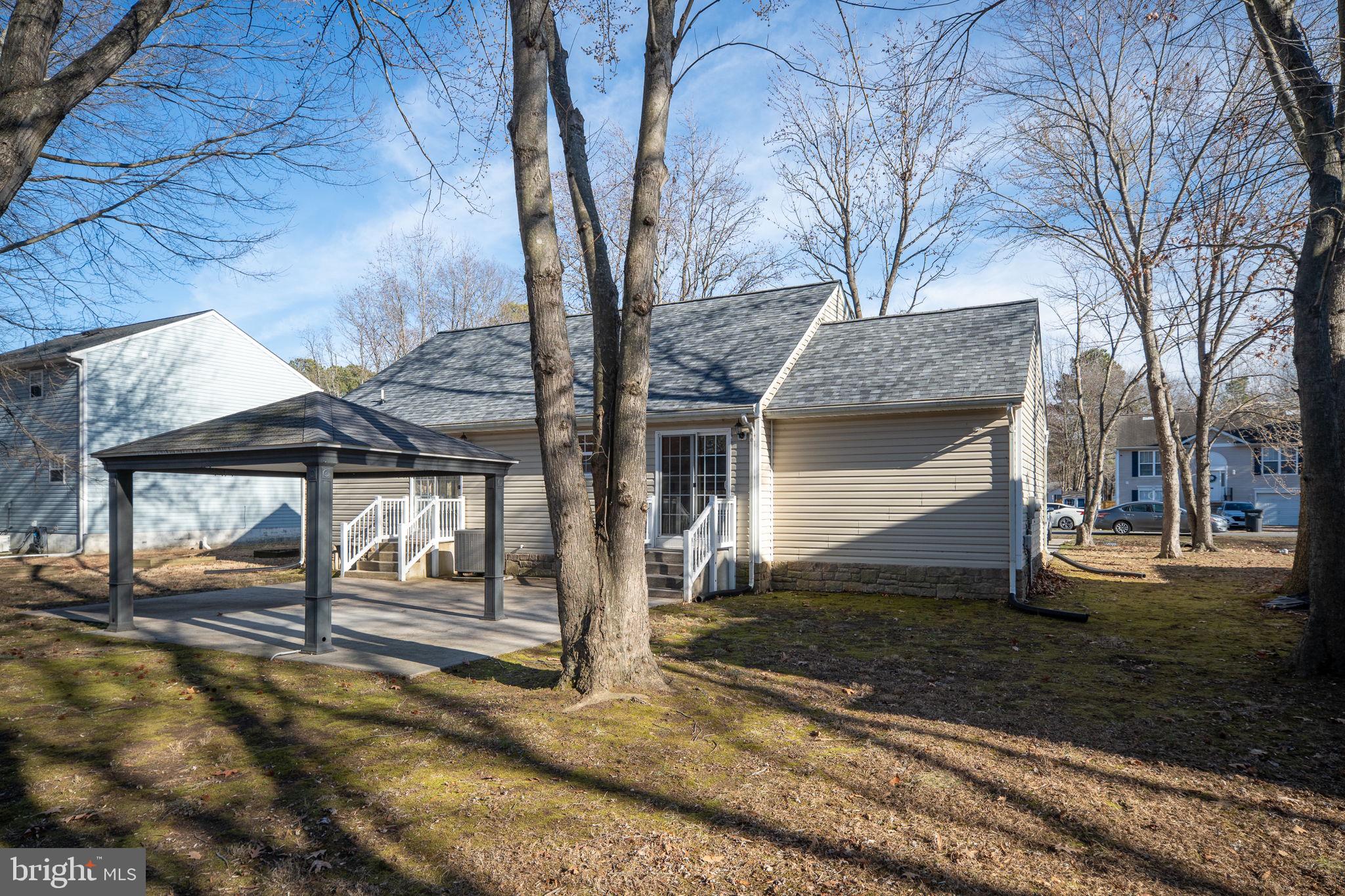 219 Santa Maria Avenue Colonial Beach, VA 22443 - Photo 35 of 52 a front view of a house with a yard