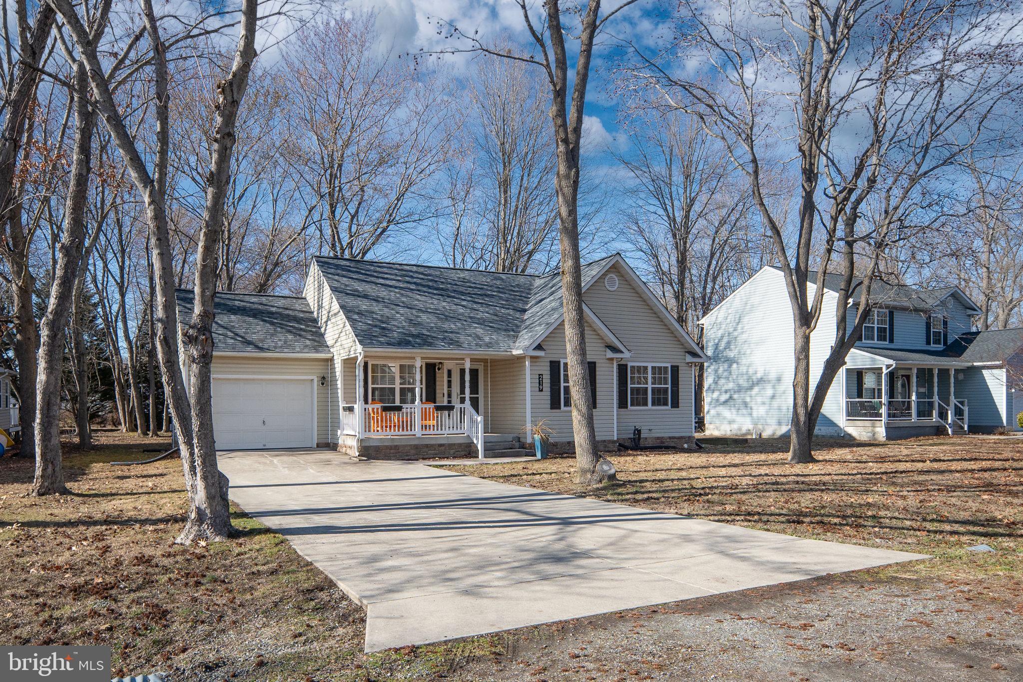 219 Santa Maria Avenue Colonial Beach, VA 22443 - Photo 41 of 52 a front view of a house with a yard