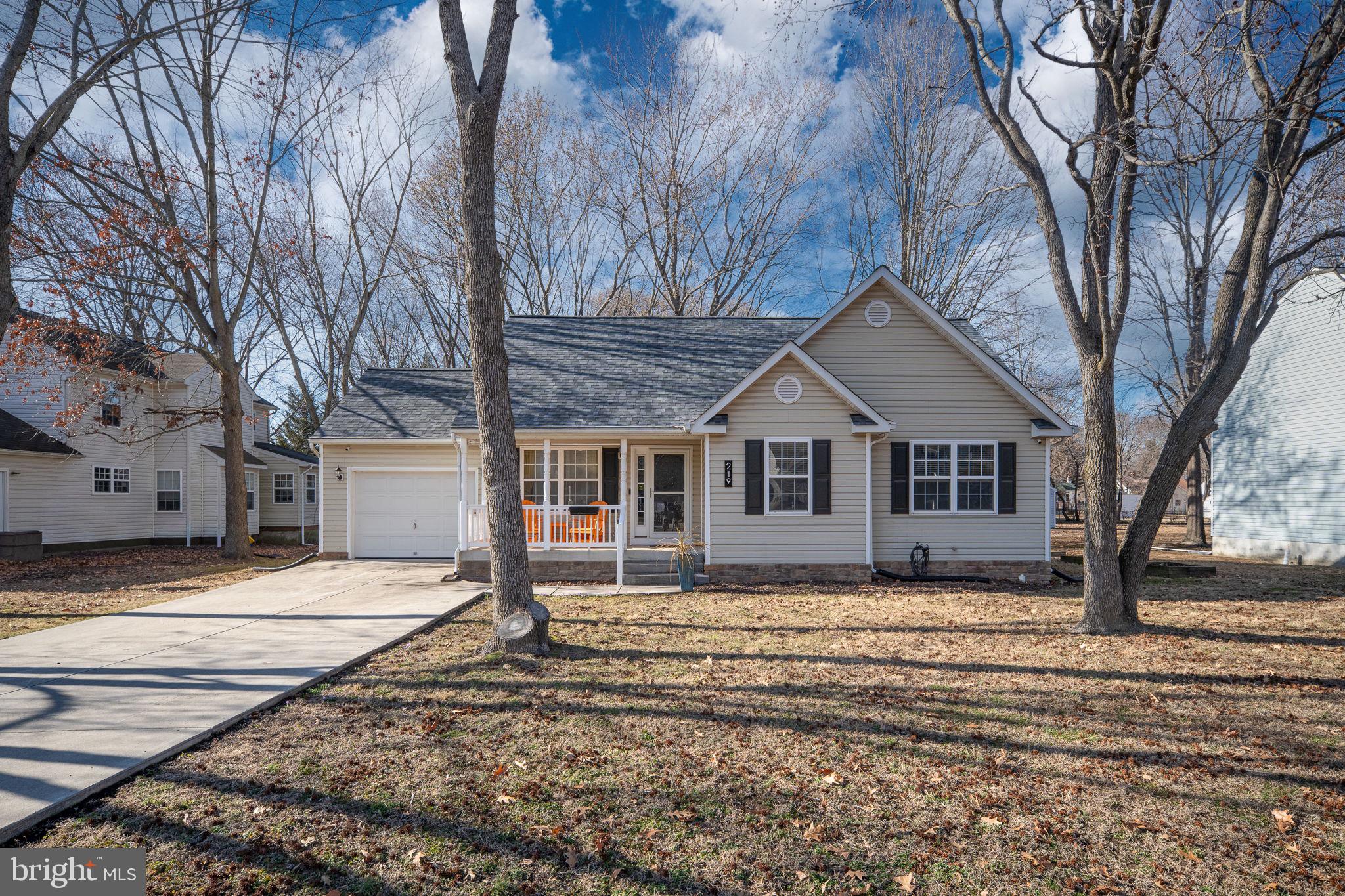 219 Santa Maria Avenue Colonial Beach, VA 22443 - Photo 43 of 52 a house that has a tree in front of it