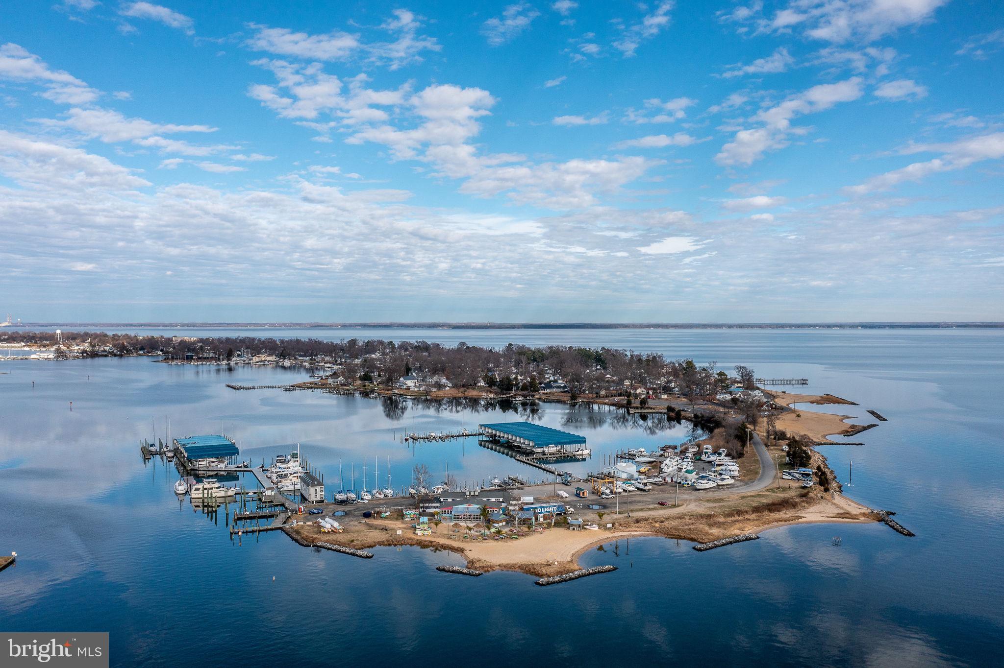 219 Santa Maria Avenue Colonial Beach, VA 22443 - Photo 49 of 52 a view of a lake with a nearby beach