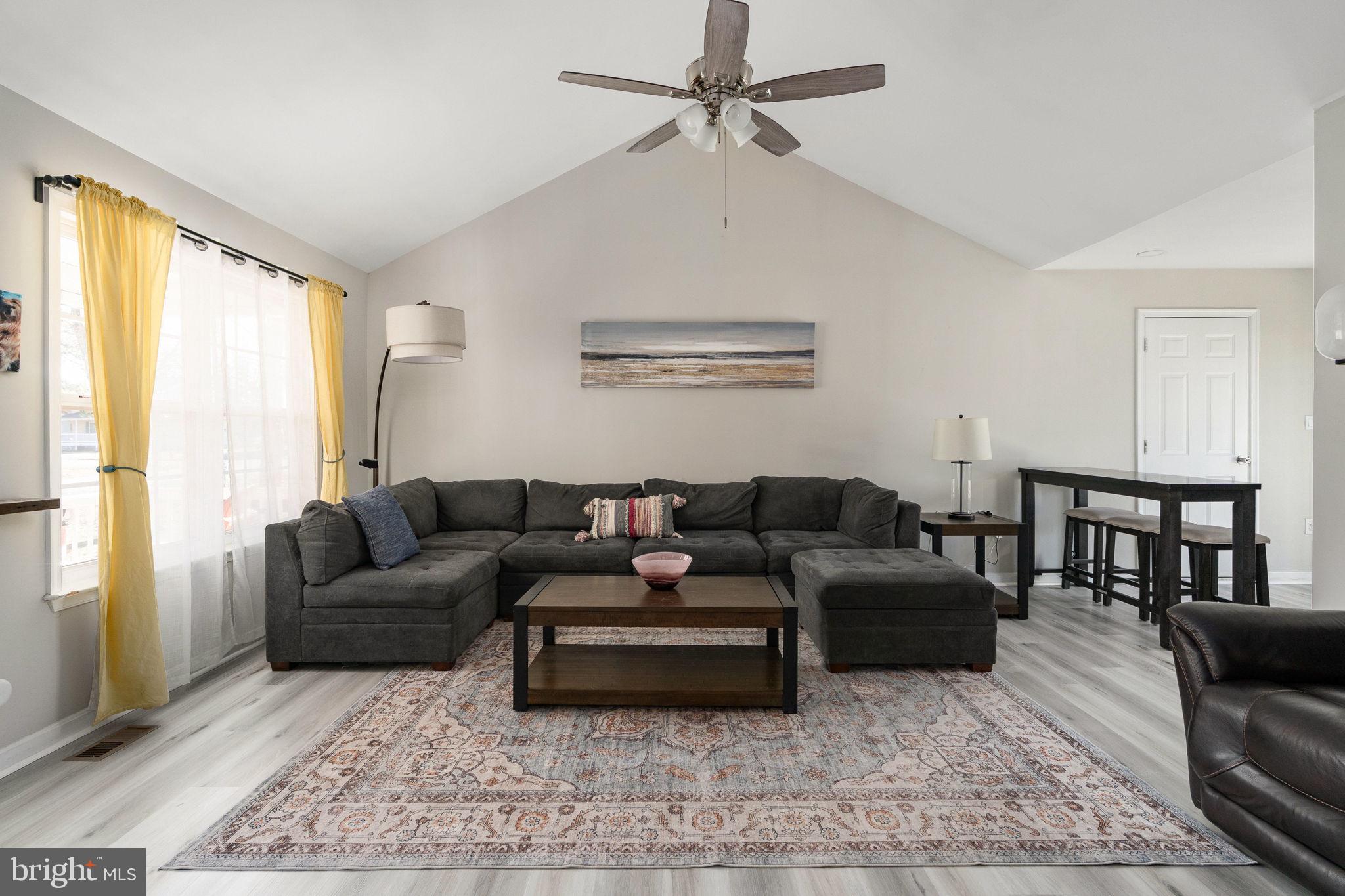 219 Santa Maria Avenue Colonial Beach, VA 22443 - Photo 5 of 52 a living room with furniture and a large window