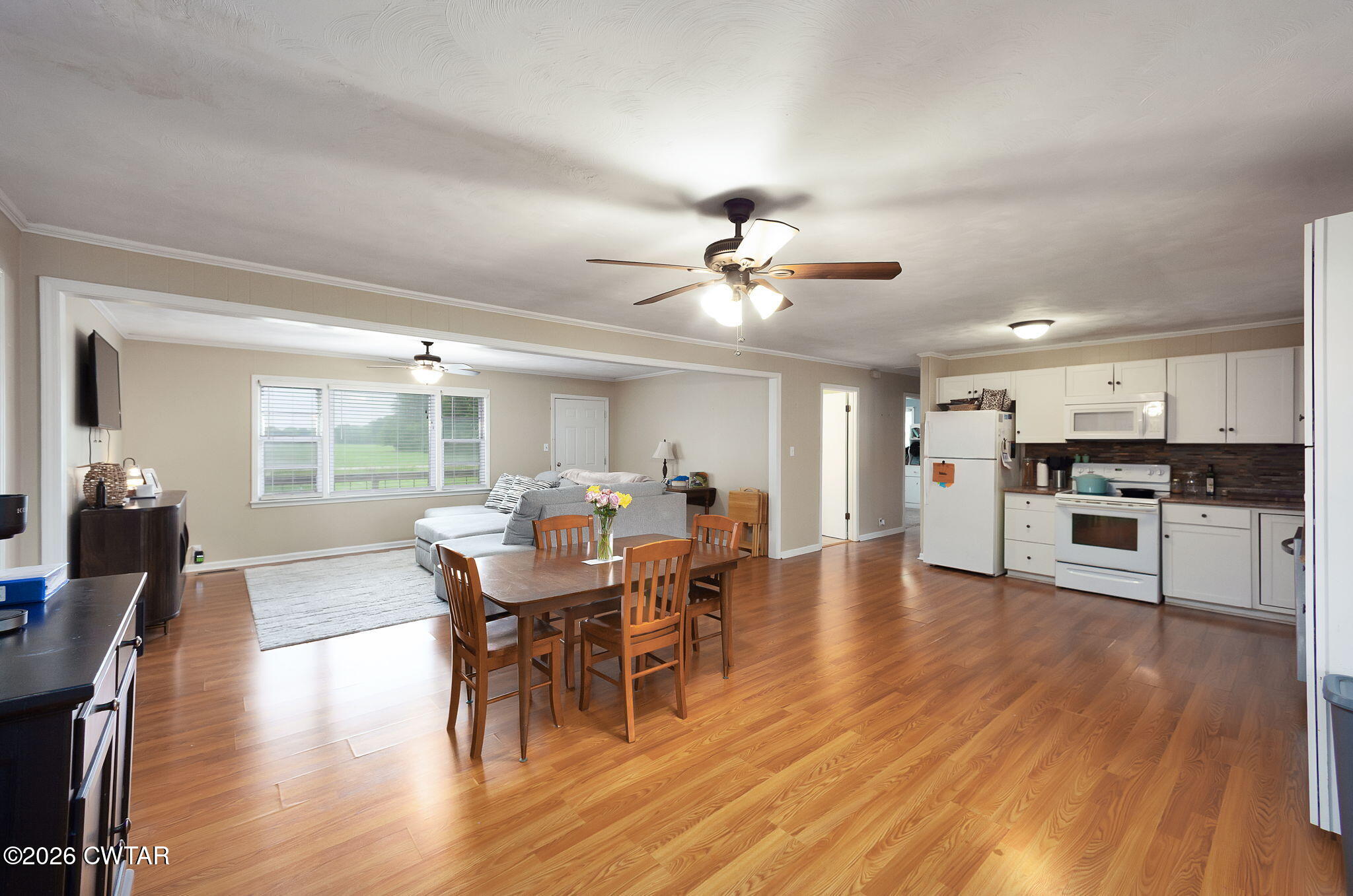 1921 Nance Road Alamo, TN 38001 - Photo 20 of 29 a view of a dining room with furniture and wooden floor