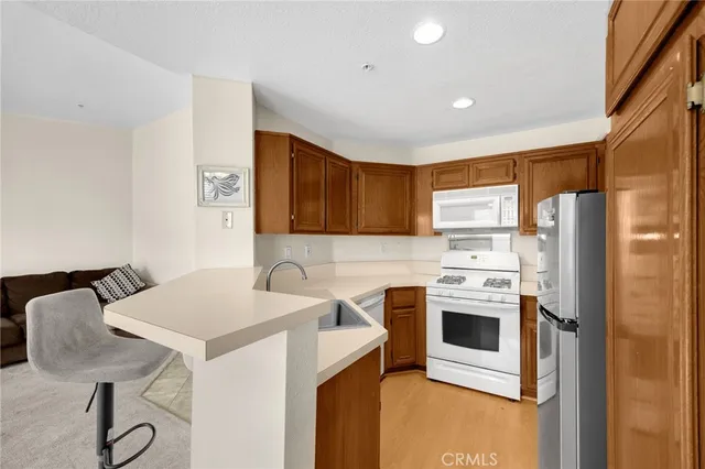 a bed sitting in a room next to a window