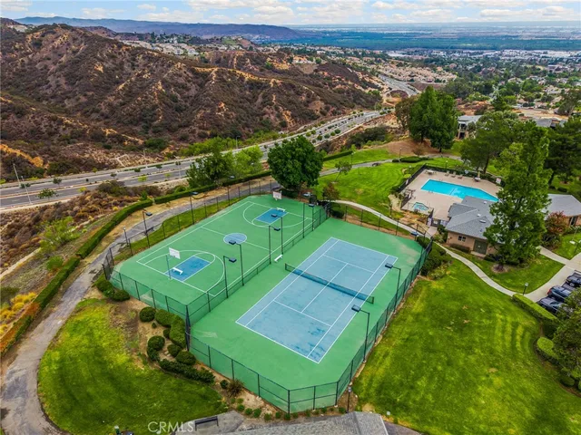 a balcony with table and chairs