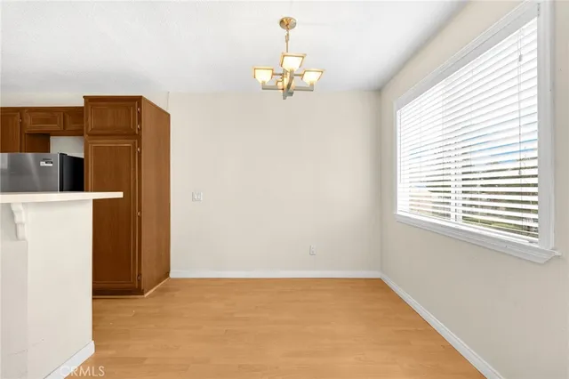 a kitchen with a sink cabinets and stainless steel appliances