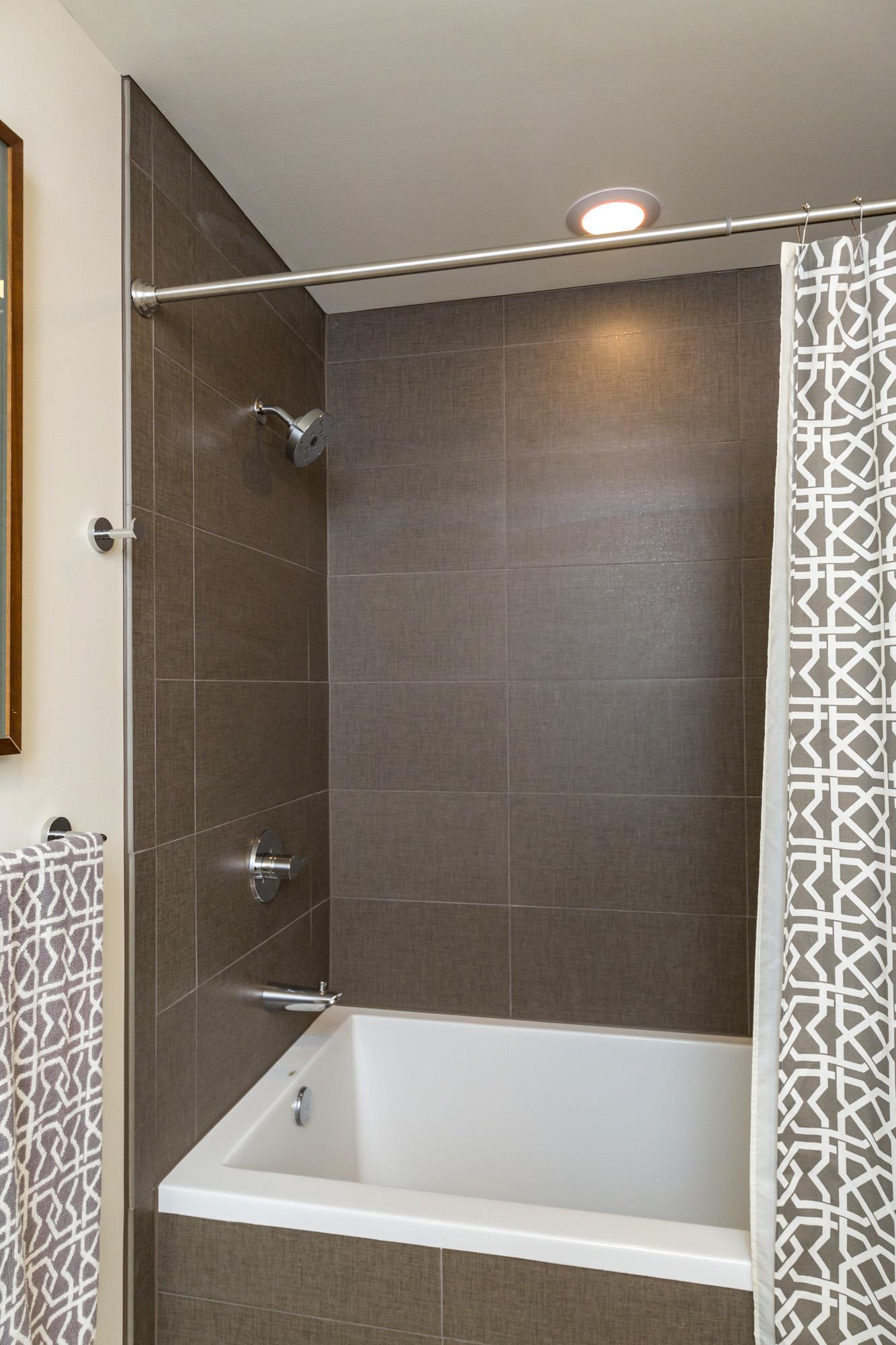 1212 Laurel Street, Unit 1312 Nashville, TN 37203 - Photo 16 of 22 a bathroom with a shower and a bathtub