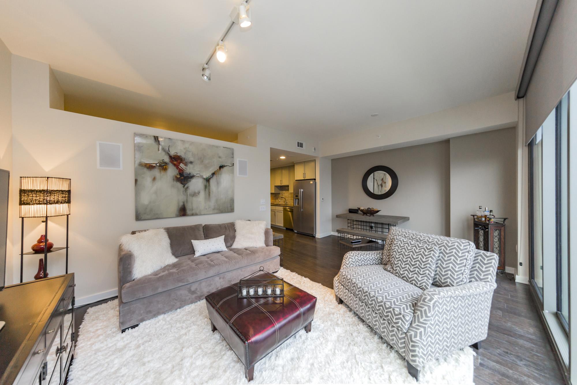 1212 Laurel Street, Unit 1312 Nashville, TN 37203 - Photo 4 of 22 a living room with furniture and wooden floor