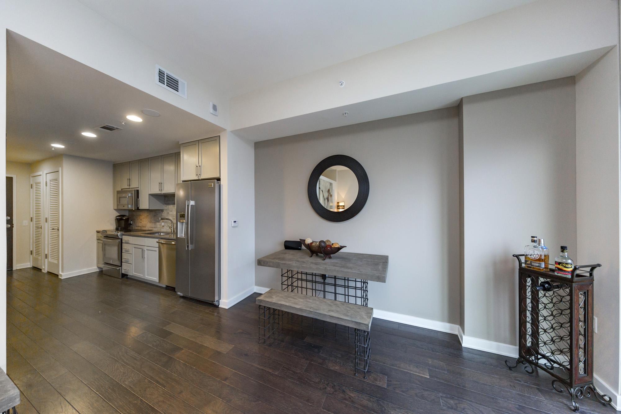 1212 Laurel Street, Unit 1312 Nashville, TN 37203 - Photo 6 of 22 a kitchen with a refrigerator and a stove top oven