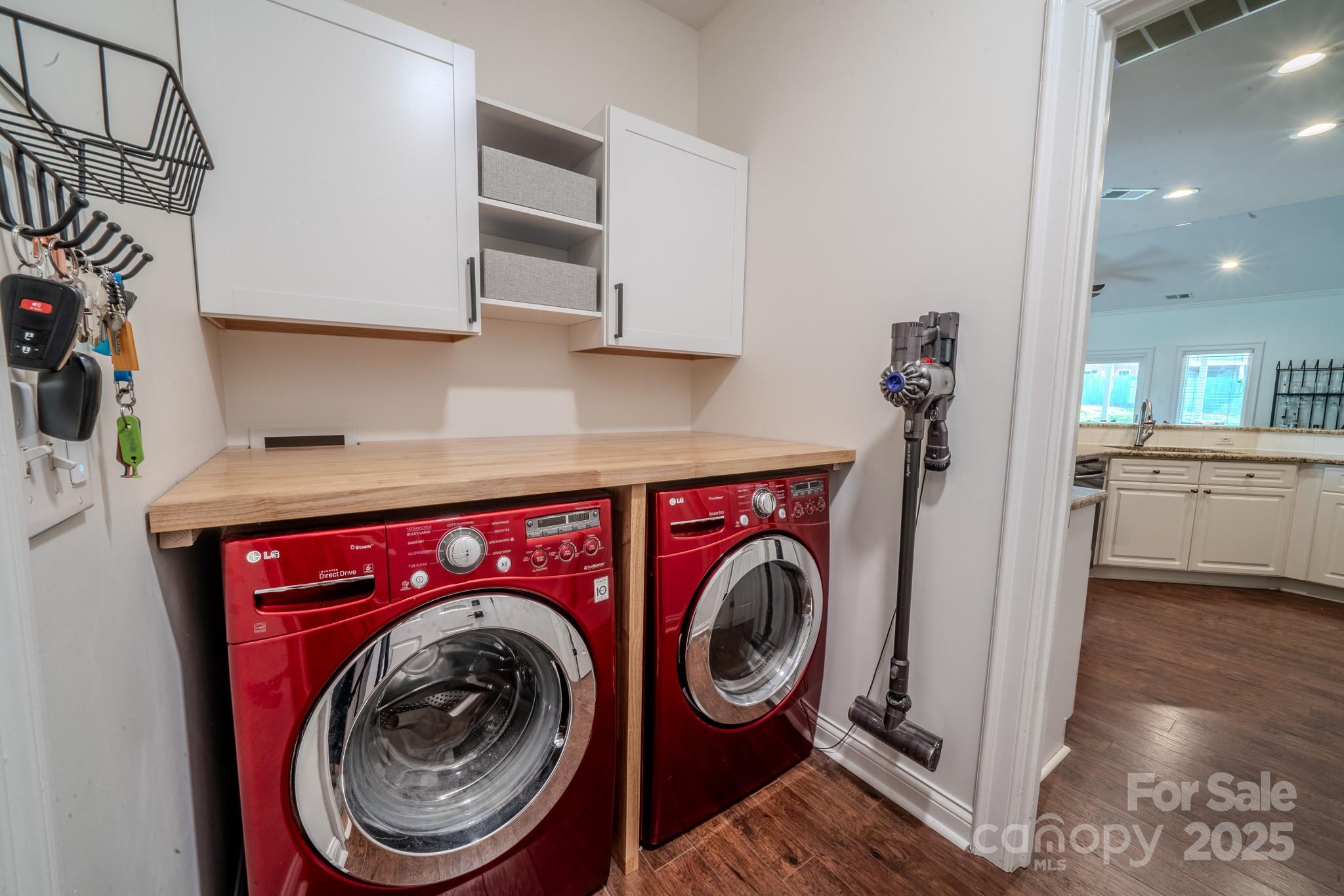 8271 Camelia Lane Denver, NC 28037 - Photo 11 of 27 a utility room with sink dryer and washer