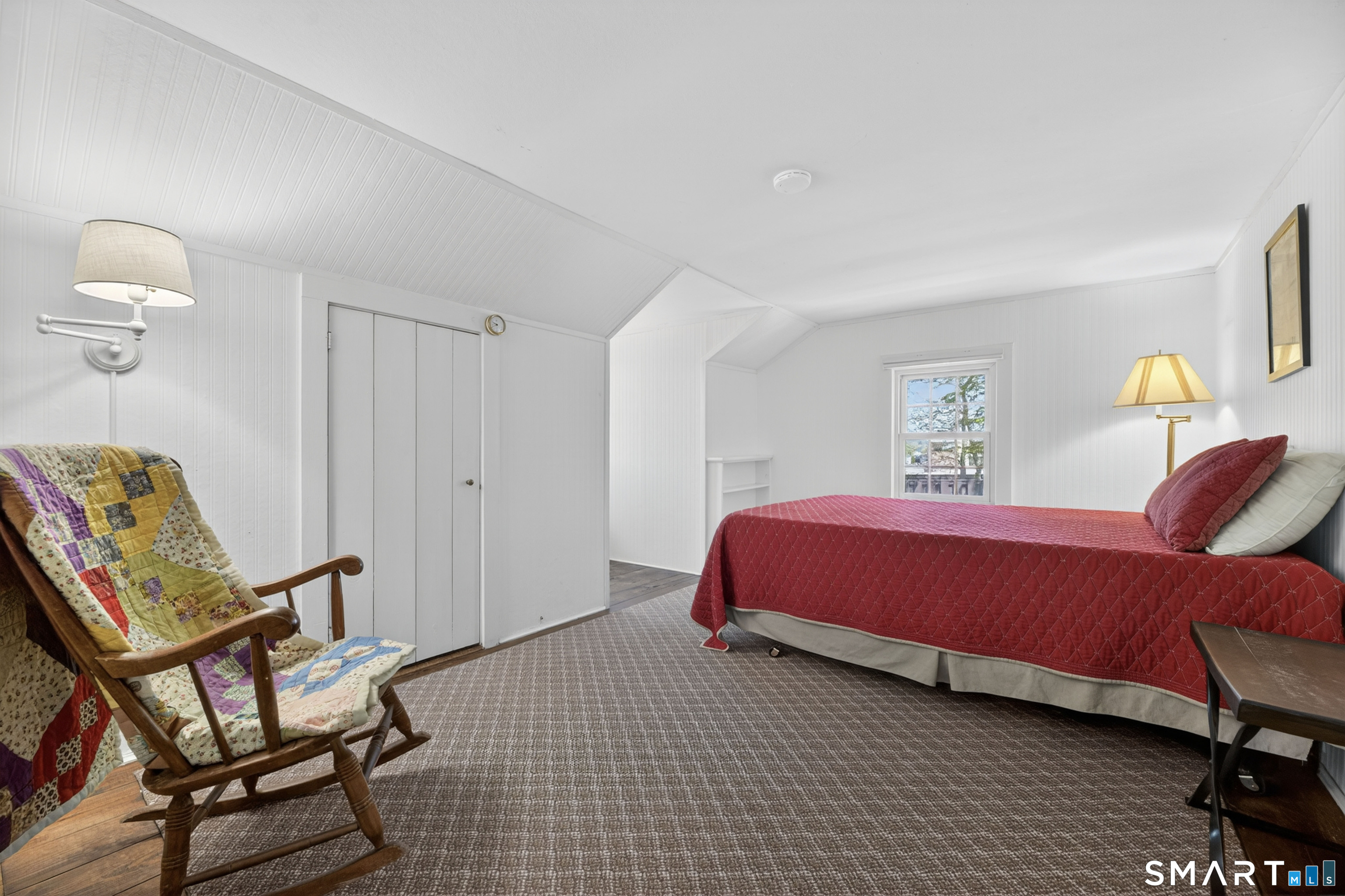 32 Money Point Road Stonington, CT 06355 - Photo 28 of 40 a bedroom with a bed and chair