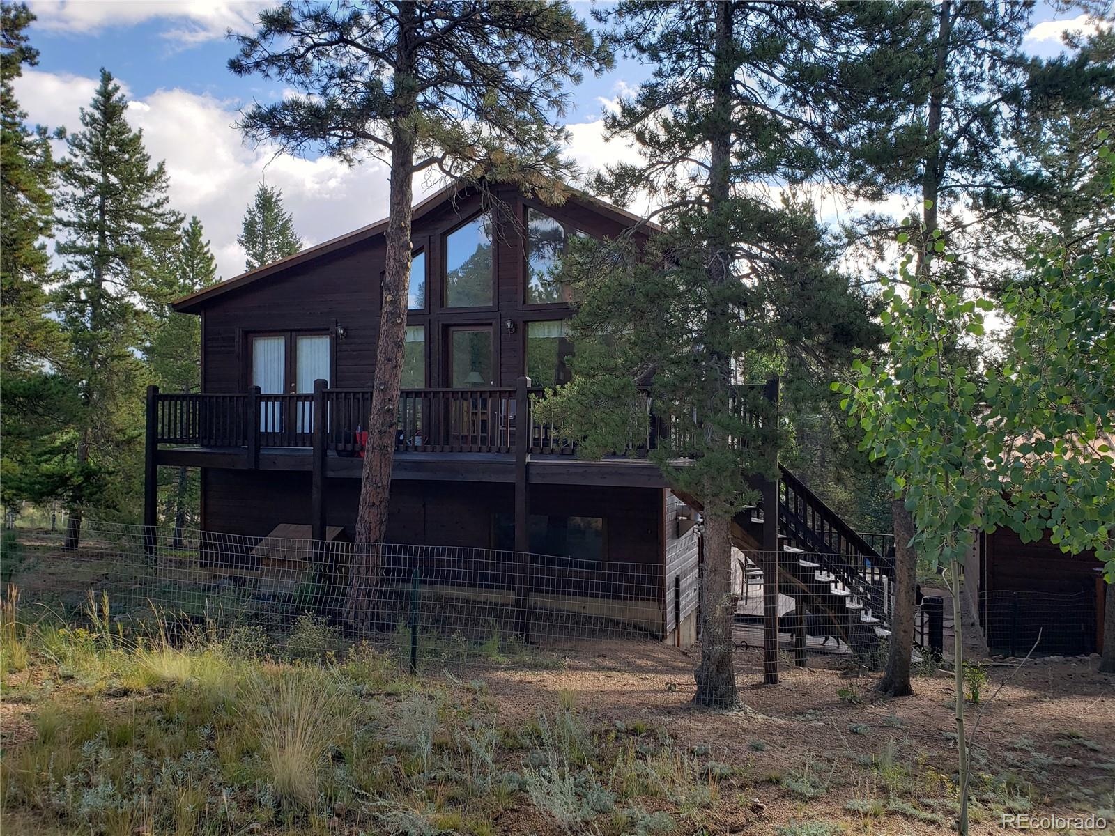 75 West Crosscut Road Bailey, CO 80421 - Photo 13 of 22 a view of house with a yard