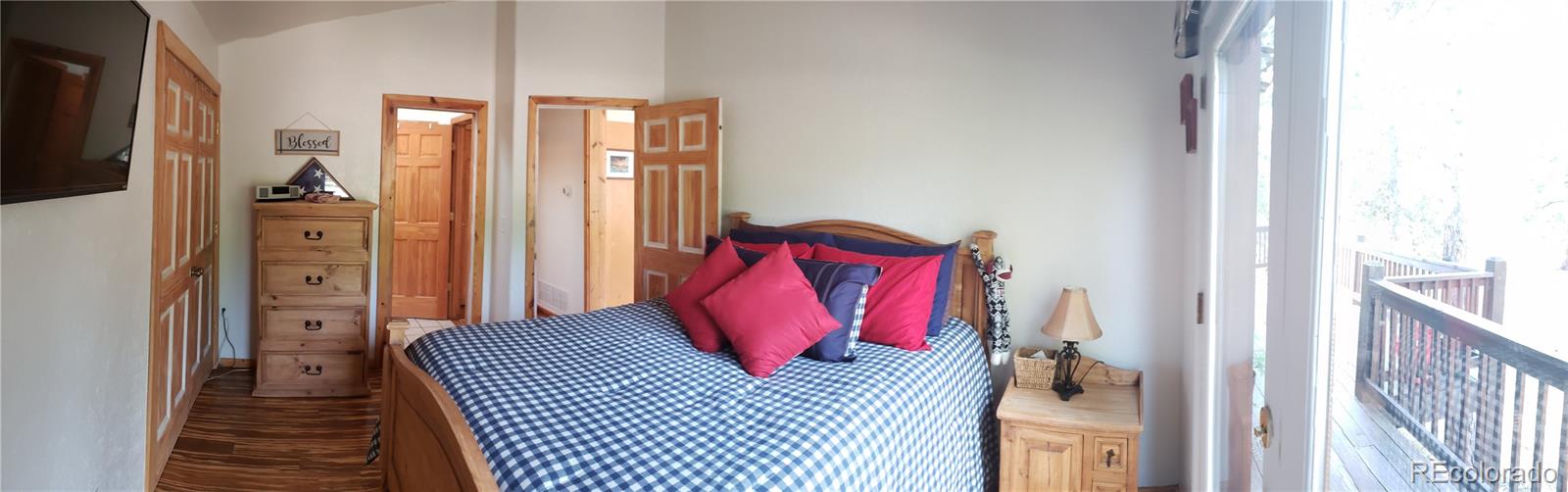 75 West Crosscut Road Bailey, CO 80421 - Photo 5 of 22 a bedroom with a bed and a couch