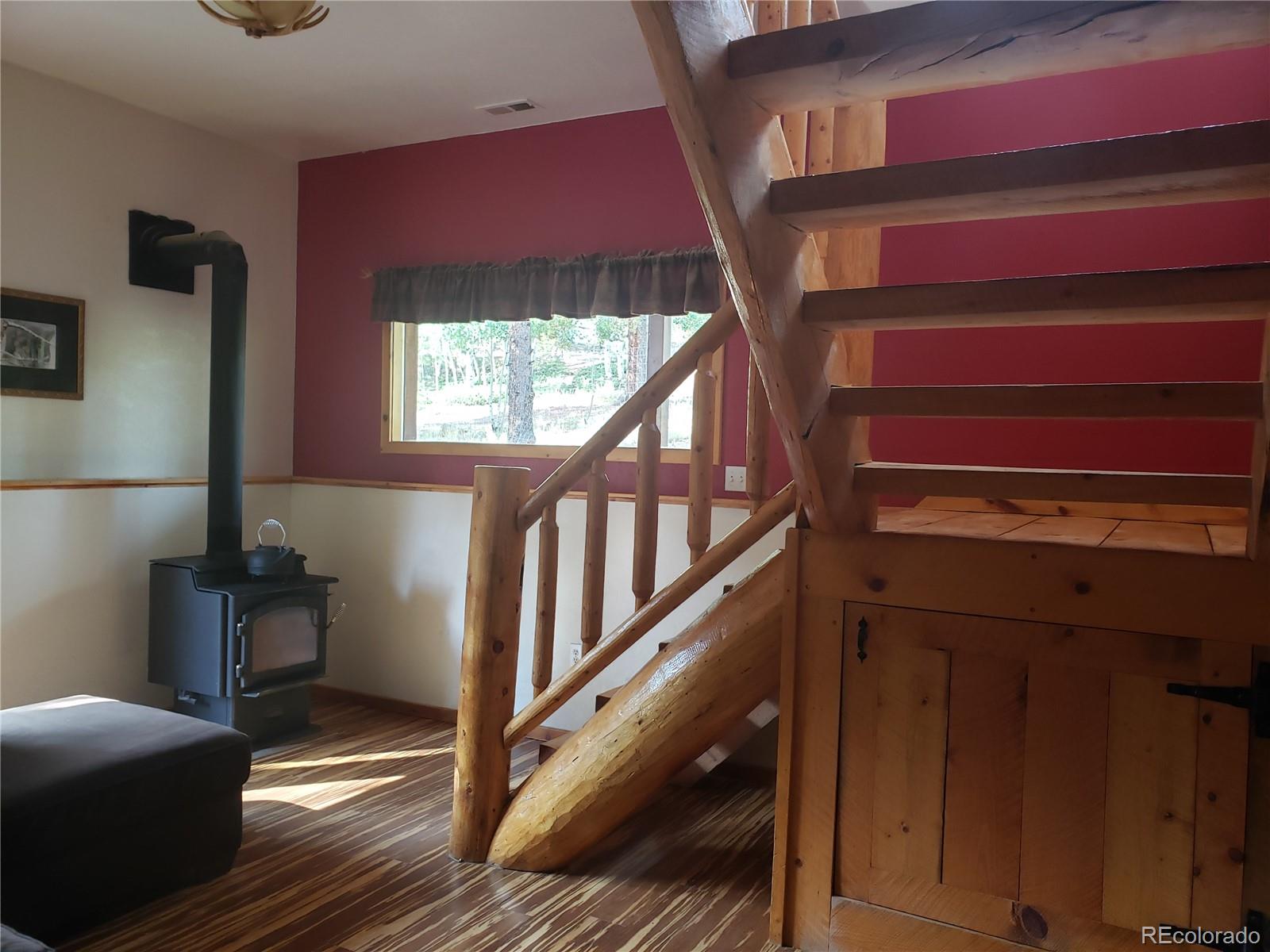 75 West Crosscut Road Bailey, CO 80421 - Photo 7 of 22 a view of entryway and hall with wooden floor