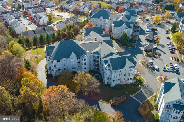 an aerial view of house with yard