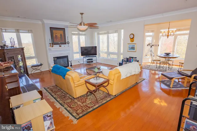 a living room with fireplace furniture and a flat screen tv