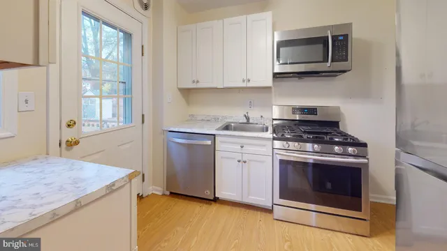 a kitchen with a stove and a microwave