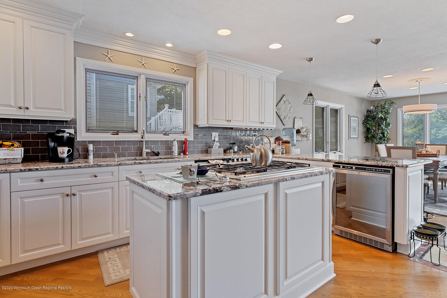 356 Silver Bay Road Toms River, NJ 08753 - Photo 11 of 41 a kitchen with a sink stove and cabinets