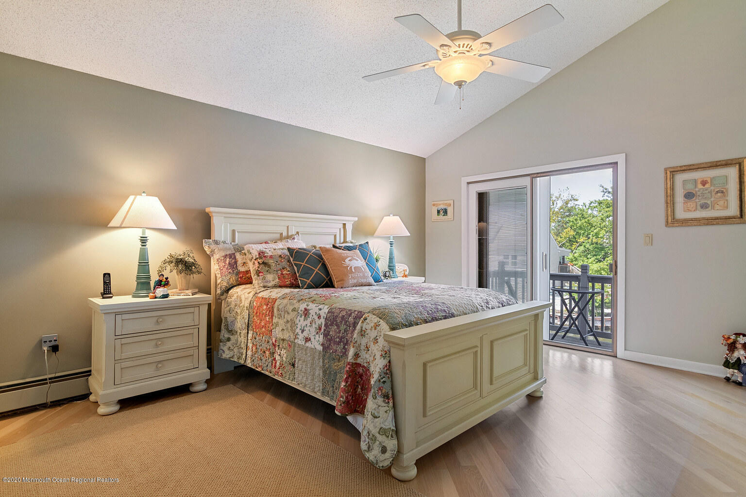 356 Silver Bay Road Toms River, NJ 08753 - Photo 13 of 41 a bedroom with a bed and a chandelier