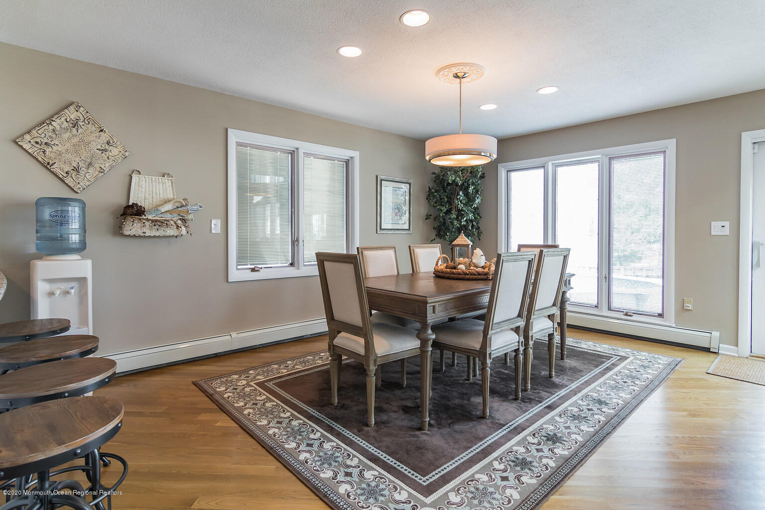 356 Silver Bay Road Toms River, NJ 08753 - Photo 15 of 41 a dining room with wooden floor a chandelier a wooden table and chairs