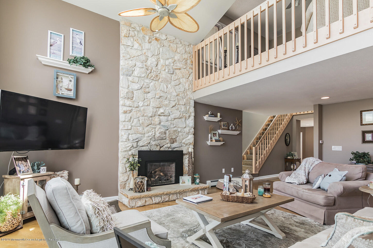 356 Silver Bay Road Toms River, NJ 08753 - Photo 17 of 41 a living room with furniture a flat screen tv and a fireplace