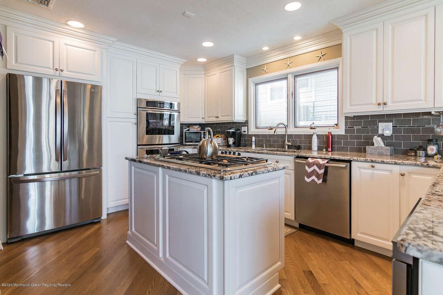 356 Silver Bay Road Toms River, NJ 08753 - Photo 20 of 41 a kitchen with kitchen island stainless steel appliances a refrigerator sink and microwave