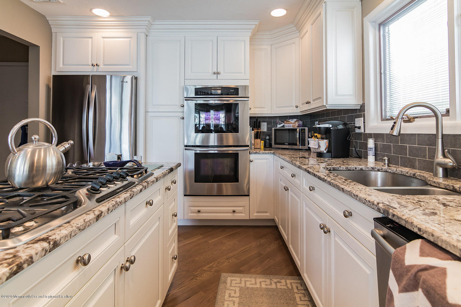 356 Silver Bay Road Toms River, NJ 08753 - Photo 21 of 41 a kitchen with stainless steel appliances granite countertop a stove a sink and a refrigerator