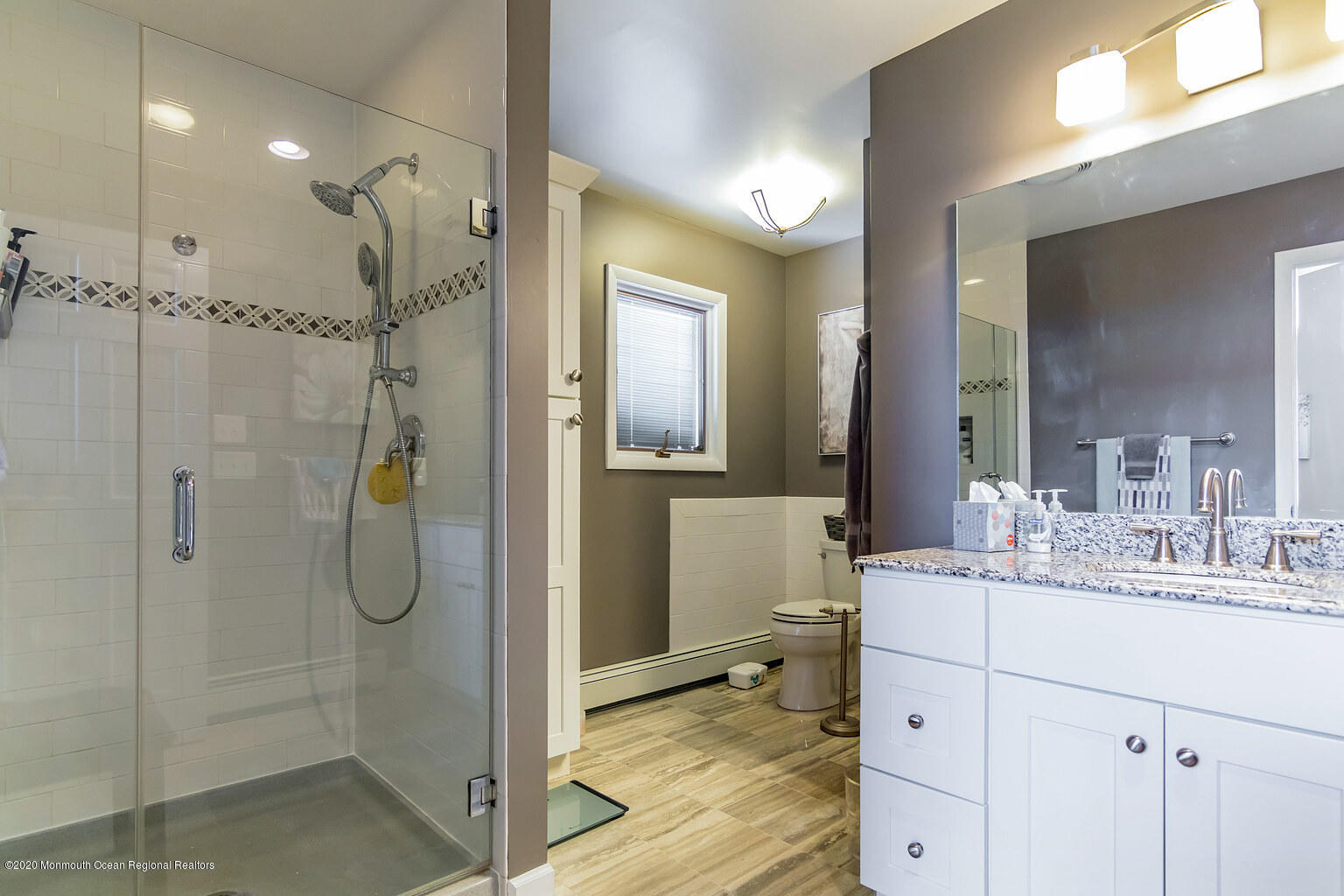 356 Silver Bay Road Toms River, NJ 08753 - Photo 28 of 41 a bathroom with a shower sink and mirror