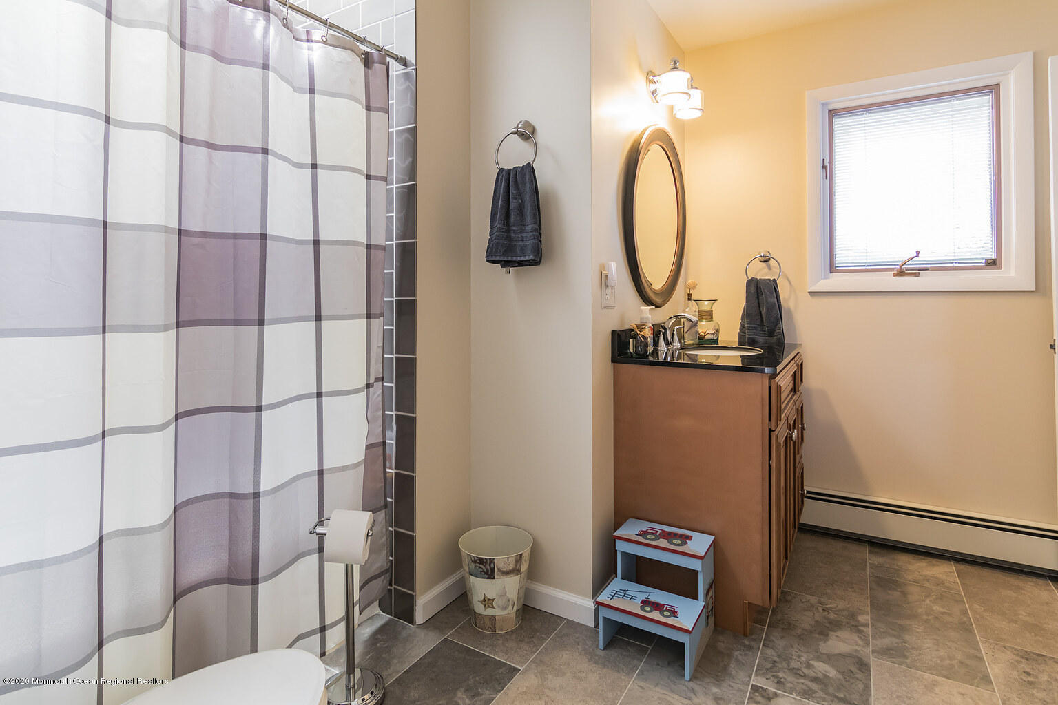 356 Silver Bay Road Toms River, NJ 08753 - Photo 30 of 41 a view of a bathroom with a sink and mirror