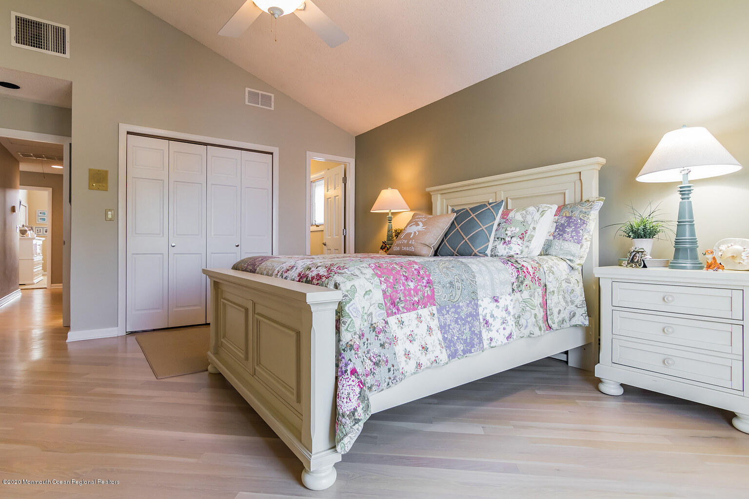 356 Silver Bay Road Toms River, NJ 08753 - Photo 32 of 41 a spacious bedroom with a bed and a lamp