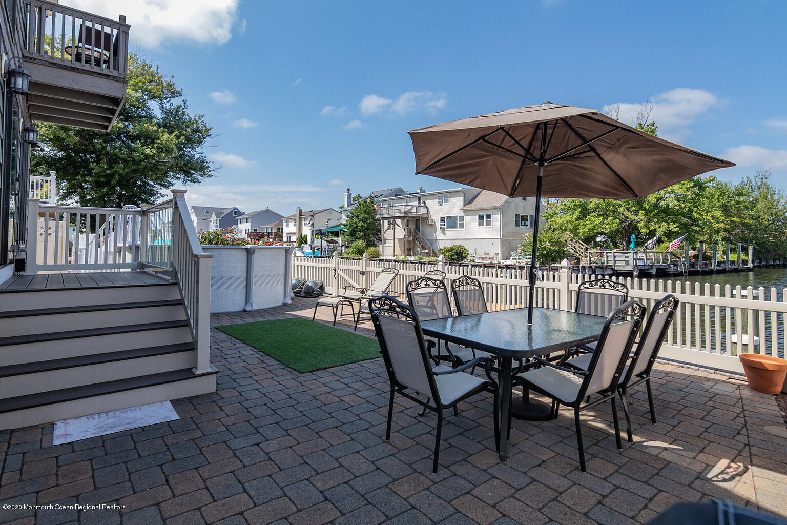 356 Silver Bay Road Toms River, NJ 08753 - Photo 35 of 41 a view of a chairs and table under an umbrella