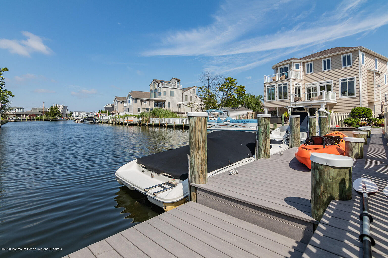 356 Silver Bay Road Toms River, NJ 08753 - Photo 39 of 41 a balcony with wooden floor table and chairs