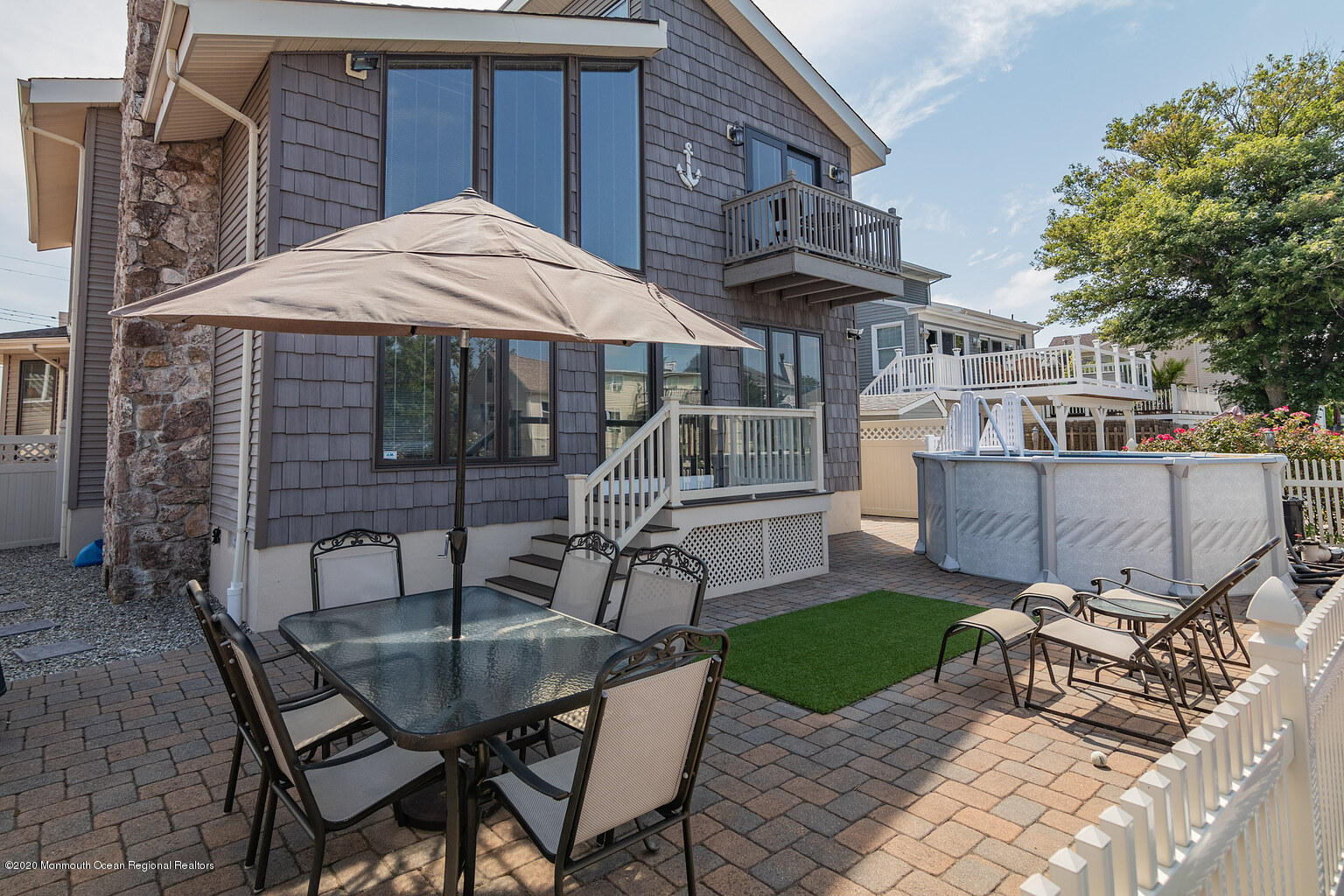 356 Silver Bay Road Toms River, NJ 08753 - Photo 40 of 41 a view of backyard with outdoor seating a patio and a garden